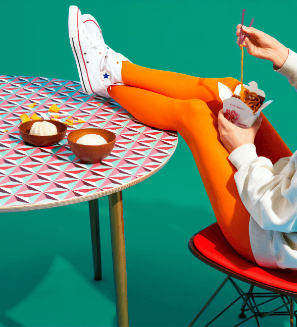 girl-eating-noodles-desk.png